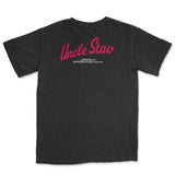 A black short-sleeve t-shirt shown from the back, featuring a red print that reads 'Uncle Stav' with smaller white text underneath reading 'A BONCHO AND ZAPRUDER FILMS PRODUCTION'.